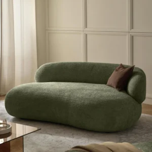 Modern elegance in motion – the ALBA 2-seater sofa with its organic silhouette, floating look, and cozy teddy bouclé upholstery is a true design statement.