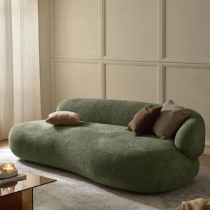 Sculptural elegance meets cozy comfort – the ALBA teddy bouclé sofa with its organic silhouette and floating look is a true design statement.