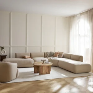 Modular corner sofa Sofia with rounded organic shapes, four-seater design, and matching cushions.