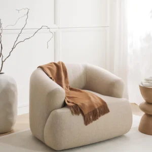 Sofia armchair with rounded organic design, eco-certified upholstery, standalone or matching piece.