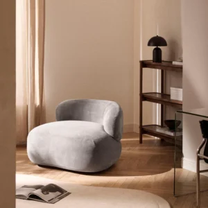 ALBA lounge chair with right-side armrest, featuring soft organic shape and premium upholstery, styled as a centerpiece for modern living rooms