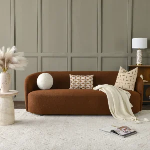 Modern 3-seater bouclé sofa with tight back, single bench cushion, and clean minimalist design in a warm brown tone