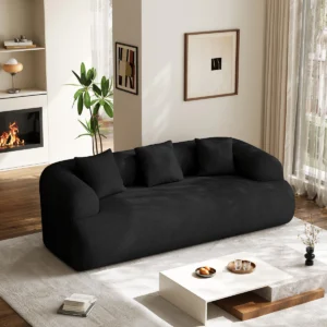 Modern low-profile Aurelia Cloud Lounge Sofa with deep cushioned seating and soft fabric upholstery in a contemporary living room setting.