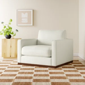 Arden 104 cm wide upholstered armchair in flannigan cotton with dark brown wood legs, pillow back, and reversible cushions — durable tear-resistant fabric, removable covers, and feather-blend comfort