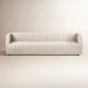 Velvet tuxedo sofa with channel tufting, structured arms, and modern glam design in a sleek silhouette