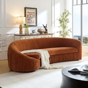 Curved fabric sofa with ergonomic backrest, plush seating, and modern sculptural design for living room.