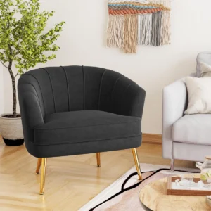 Celeste 69 cm wide velvet upholstered armchair with barrel silhouette, vertical channel stitching, curved back, sloping arms, and tapered gold‑finished metal legs