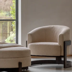 Cercola lounge chair with curved backrest, plush upholstery, and dark wood frame