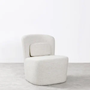 Noa armchair with compact structure, soft lines, and minimalist base, upholstered in high-quality fabric for ergonomic comfort and refined style