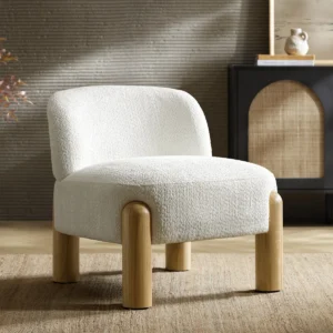 Bouclé upholstered armless accent chair with fixed back and natural rubberwood legs.