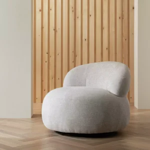 Grey upholstered swivel hug chair with rounded silhouette, legless design, and black steel base.