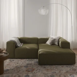 Modern modular LENNON sofa with low backrest, deep seating, and soft cushions in a contemporary living room