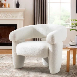 Liora three-legged barrel accent chair upholstered in soft bouclé fabric, featuring flared arms and solid wood frame for comfort and contemporary style.