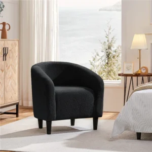 Black bouclé upholstered barrel accent chair with curved arms and solid wood frame, designed for modern living spaces.
