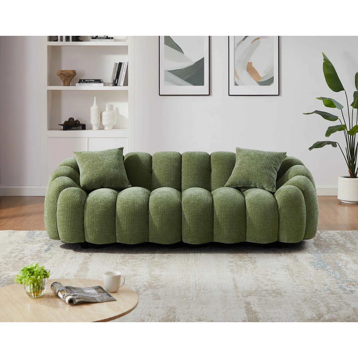 Green modular sofa with curved petal-shaped armrests and plush cushioned seating in modern living room setting