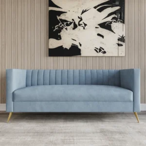 Marcellus 189 cm velvet sofa with tuxedo arms, vertical channel tufting, and gold metal legs styled in a contemporary living room.
