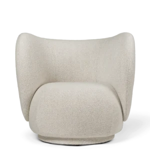 Rico Lounge Chair in soft bouclé fabric with curved, embracing design and textured upholstery