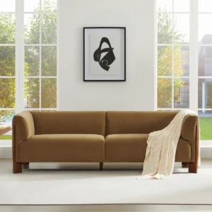 Solara 224 cm velvet sofa with tuxedo arms, tapered ash wood legs, and included accent pillows