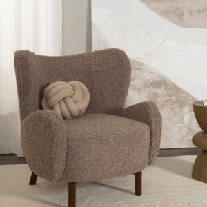 Taupe teddy fabric wingback armchair with dark wood beech legs, designed for reading, streaming, and relaxing