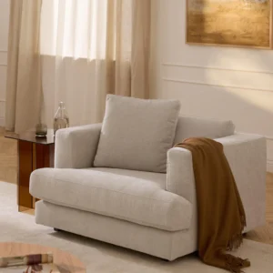 Light beige fabric reclining sofa with removable cushions and black wooden legs