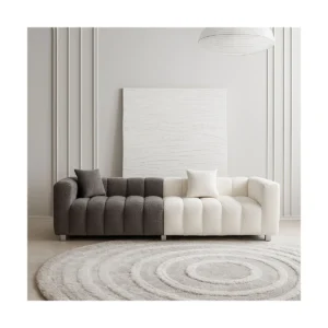 Valencia 222 cm velvet sofa with low backrest, channel tufting, and sculpted arms, styled as a modern 3-seater couch in a contemporary living room