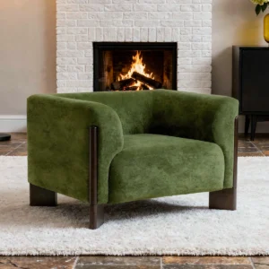 Modern green chenille armchair with curved arms, pocket spring seat, and wooden legs