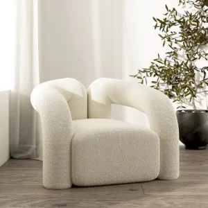 White bouclé accent chair with minimalist design and textured upholstery, ideal for modern interiors