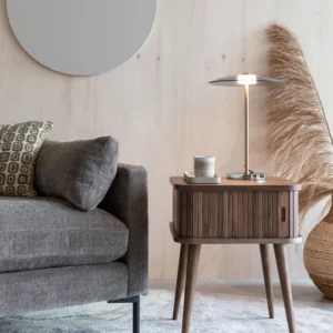 Barbier wooden bedside table with roll-up door, grooved front, and angled legs, combining functionality with elegant design.