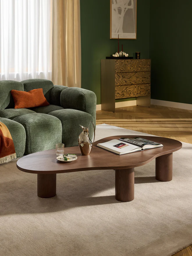 XL Didi coffee table in solid oak wood with organic shape and wide round legs, available in natural, dark brown, or black finishes