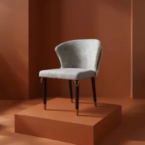 Classic Dining Chair with steel legs and velvet upholstery, featuring refined detailing and medium-firm cushioning in a modern dining room setting