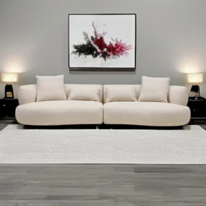Harlow modular sofa in beige fabric with curved silhouette and secure connectors, designed for versatile layouts and harmonious interiors
