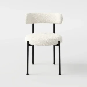 Lulu Dining Chair with sleek silhouette, refined curves, and plush ergonomic seating, styled for modern dining spaces