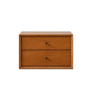 Compact Nadia bedside table with two deep drawers and brass knobs, designed with a vintage-inspired silhouette for timeless bedroom style.