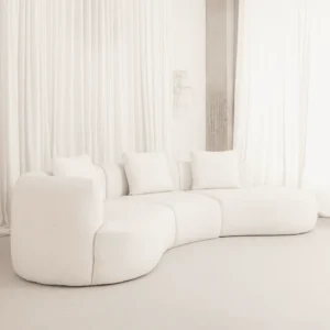 Eddy Curve Sofa with rounded silhouette, smooth curves, and plush cushioned seating in a contemporary living room setting