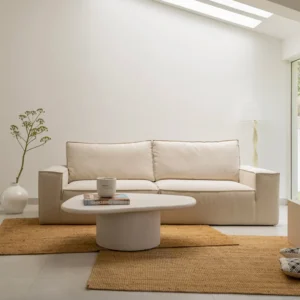 Gavin Sofa with clean lines, compact L-shaped silhouette, and minimalist design, styled in a contemporary apartment living room.
