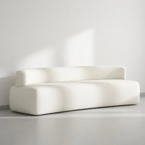 Constance Low Seating Sofa with low-profile silhouette, smooth curvy form, deep supportive seating, soft cushioning, and minimalist design for modern interiors