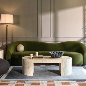 The Eloise Sofa makes a bold statement with its minimalist silhouette and striking hue