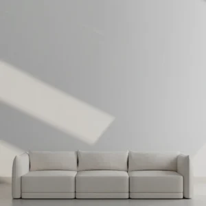 Jules Sofa with clean-lined silhouette, deep feather-wrapped cushions, upholstered in premium fabric, supported by a solid wood frame, crafted in Dubai.