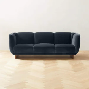 A stylish 3-seater sofa crafted from durable teak wood with elegant fabric upholstery, featuring clean lines, plush cushions, and timeless design for a cozy and sophisticated living room