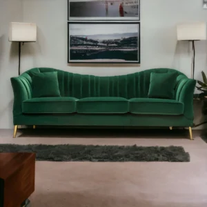 A modern 3-seater sofa upholstered in premium green fabric with plush cushions, sturdy wooden frame, and sleek metal legs, offering spacious comfort and a bold contemporary look