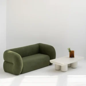 Ruthis Sofa with rounded edges, curved silhouette, and deep memory foam seating in a contemporary living room setting.